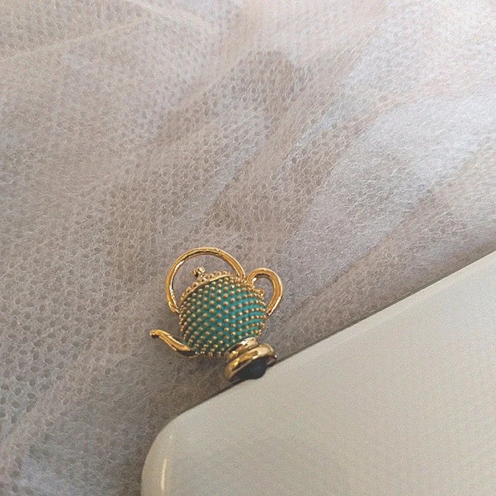 Tea pot cellphone dust plug